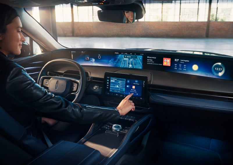 The driver of a 2024 Lincoln Nautilus® SUV interacts with the center touchscreen. | Cavalier Lincoln in Chesapeake VA