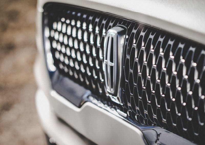 The grille of the 2022 Lincoln® Aviator Reserve model with an eye-catching repeated field of Lincoln® Star logo shapes