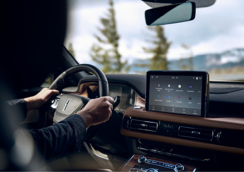 The Lincoln®+Alexa app screen is displayed in the center screen of a 2022 Lincoln® Aviator
