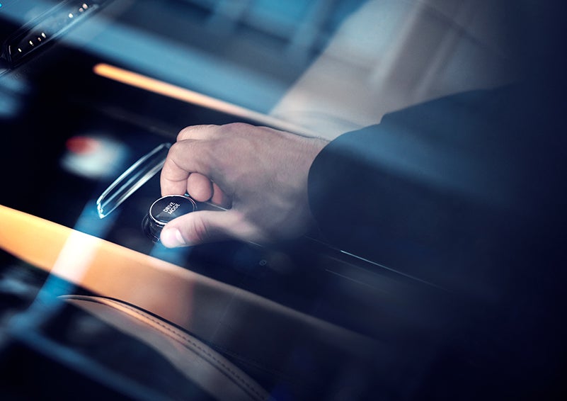 The driver of a 2023 Lincoln Corsair® SUV is shown adjusting the drive mode. | Cavalier Lincoln in Chesapeake VA