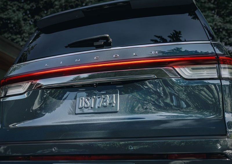 The wraparound rear lights of a Lincoln Navigator SUV are shown. | Cavalier Lincoln in Chesapeake VA