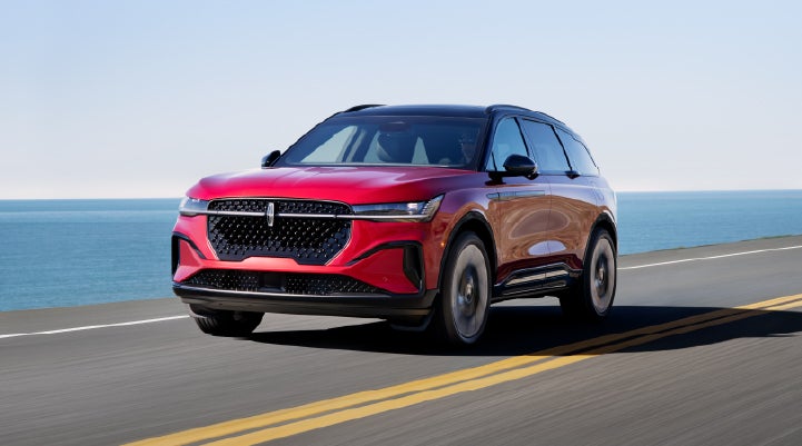 A 2025 Lincoln Nautilus® SUV is being driven on a seaside roadway. | Cavalier Lincoln in Chesapeake VA