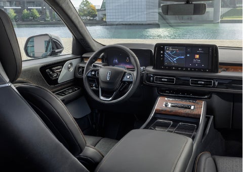 The interior of the 2026 Lincoln Aviator® SUV is shown parked with a view of a harbor through the windshield. | Cavalier Lincoln in Chesapeake VA