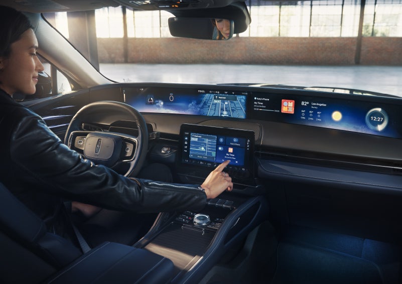 The driver of a 2026 Lincoln Nautilus® SUV interacts with the center touchscreen. | Cavalier Lincoln in Chesapeake VA
