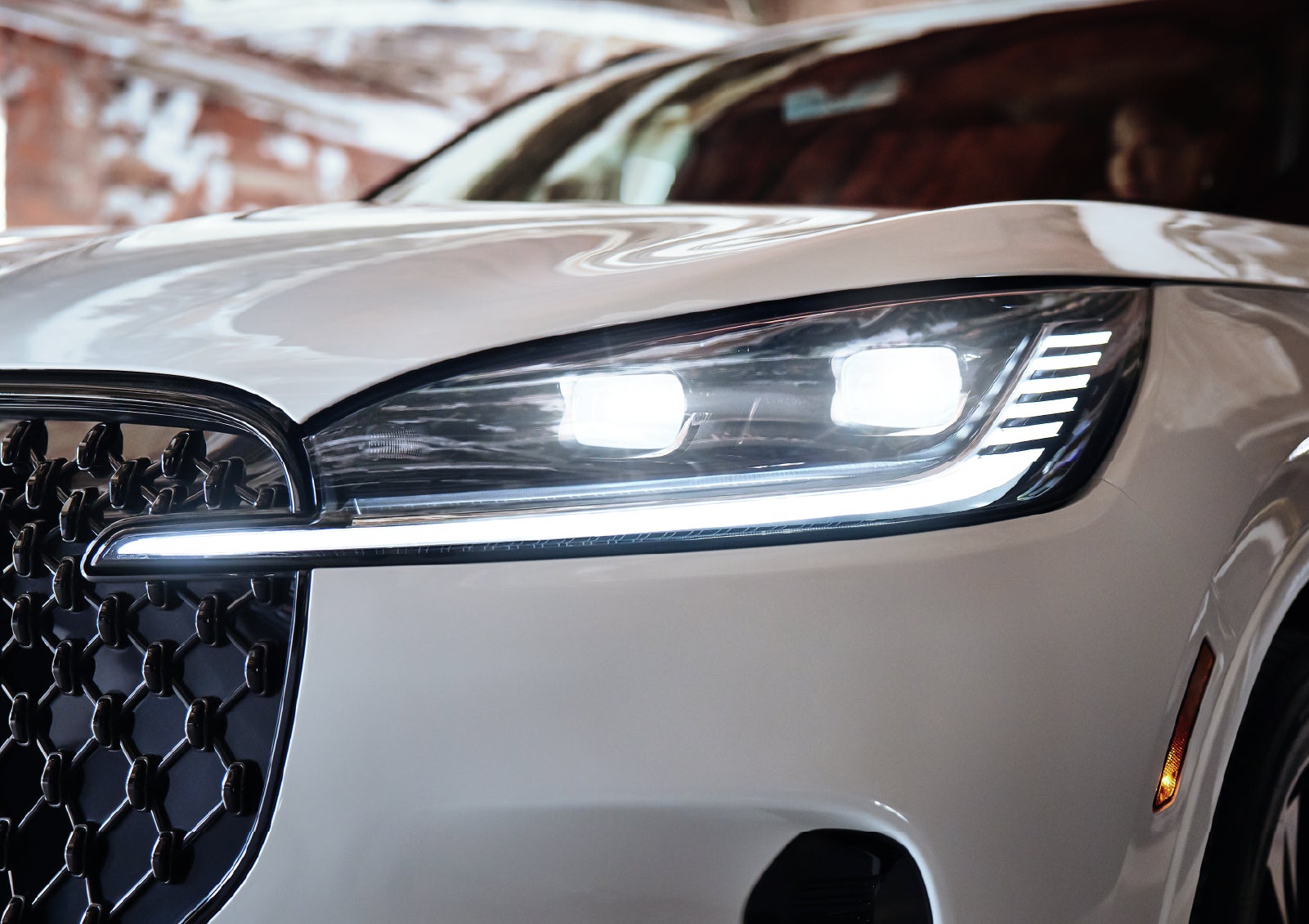A close-up of a headlamp on the 2027 Lincoln Aviator® SUV is shown. | Cavalier Lincoln in Chesapeake VA