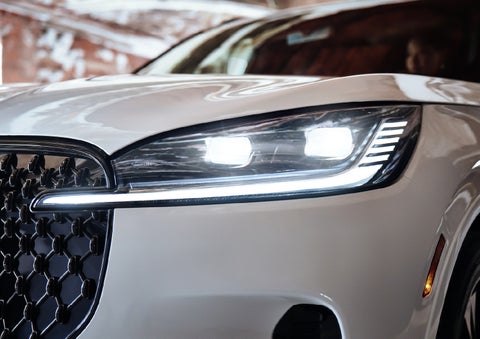 A close-up of a headlamp on the 2027 Lincoln Aviator® SUV is shown. | Cavalier Lincoln in Chesapeake VA