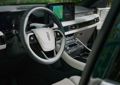 The leather-trimmed steering wheel of a 2027 Lincoln Aviator® Black Label™ SUV. | Cavalier Lincoln in Chesapeake VA