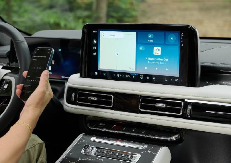 A person pairs thier phone with the center touchscreen of a 2027 Lincoln Aviator® Black Label™ SUV | Cavalier Lincoln in Chesapeake VA